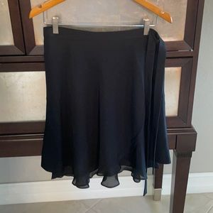 Black Lauren wrap around flounce skirt size 6 never worn. Hits just above knee